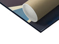 A large blue table holding parchment paper next to paper.