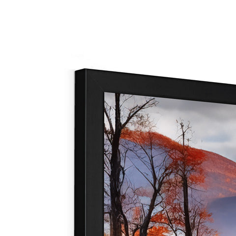 A close view of a picture frame with a large television on it.