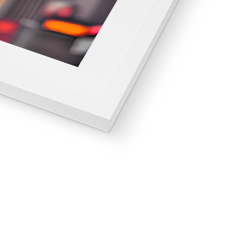 A white photo of an imac sitting on a glass surface posing in a picture frame