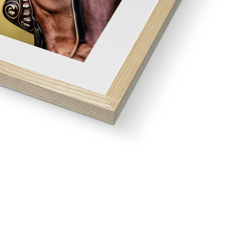 a picture frame holding a portrait of the horse on a wood floor