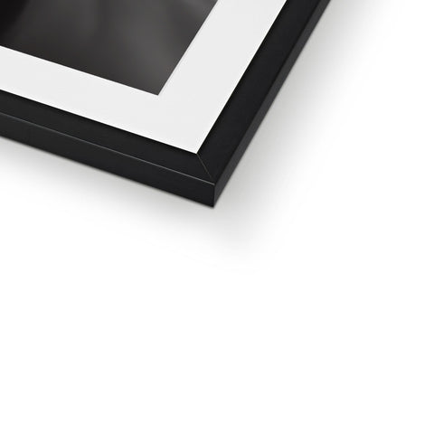 A photo of a frame holding a black and white photo on it