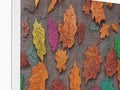 A picture of some bright colored leaves on a wall on a card wall in the front