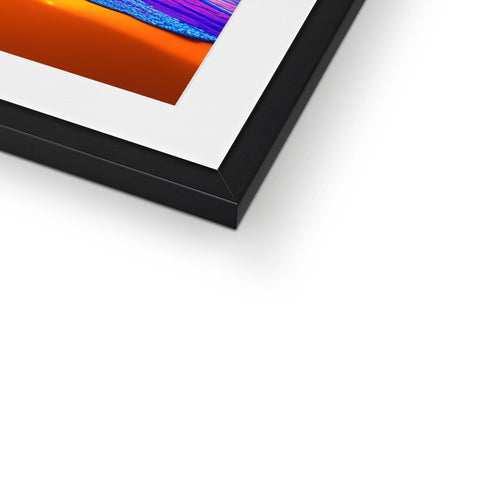 A picture frame with an orange, black and white print on it.
