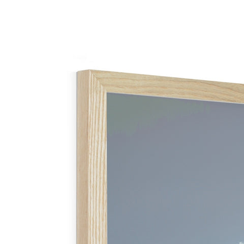 A wooden framed wooden picture frame with a mirror is visible.