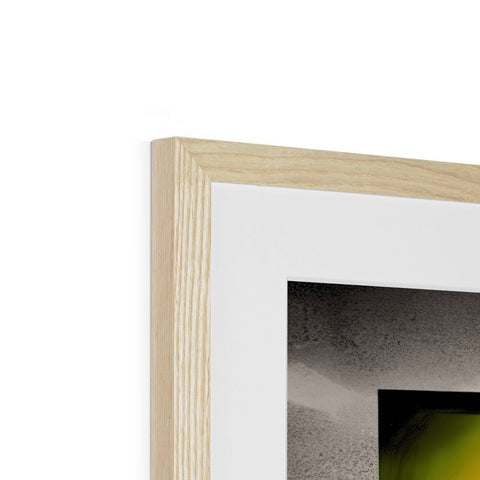 A close up picture of a wooden frame with a piece of art in a frame on