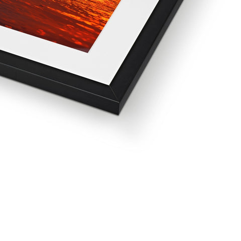 A picture frame is lying on top of the frame with a white image.
