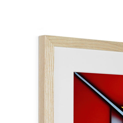 A white piece of framed artwork has a red triangle near a black line