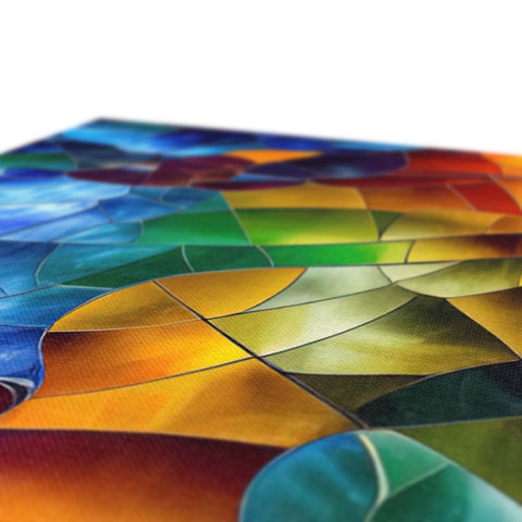 A colorful tile with three colored brushes on the table.