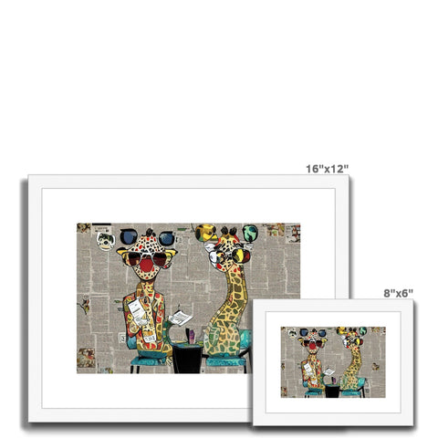A couple of pictures of art prints on ceramic tile sitting on top of a table with