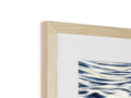 A white wooden frame with a picture of the blue water on it with waves rushing to