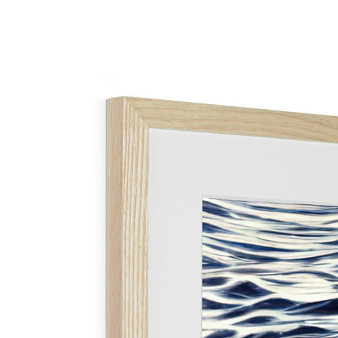 A white wooden frame with a picture of the blue water on it with waves rushing to