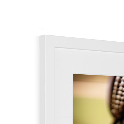 a close up of a pair of photo frames framed on a wall