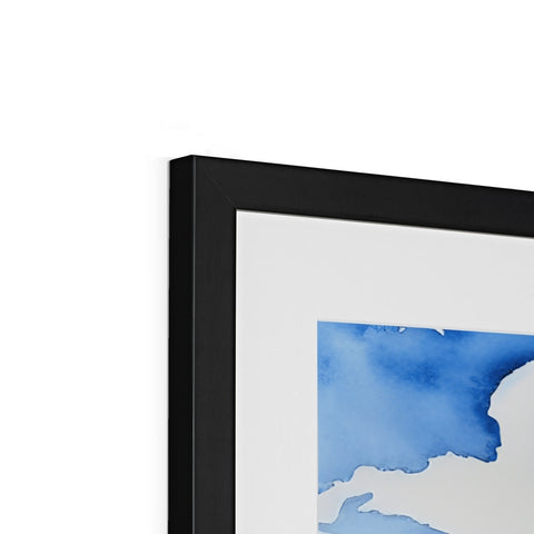 A large framed art print hanging on a wall of blue and black screens.