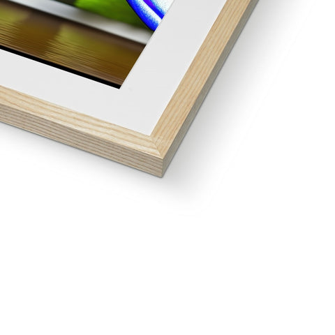 An attractive photograph of an abstract picture hanging in a wooden frame on a wall.