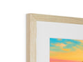 A wood photo is framed with white wood in a frame on a wall.
