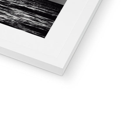 a black photo of the waves below a white photo frame