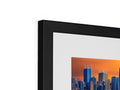 A flat panel photo that is displayed in front of a table with a picture frame sitting