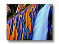 A colorful art print with a river flowing down a waterfall.