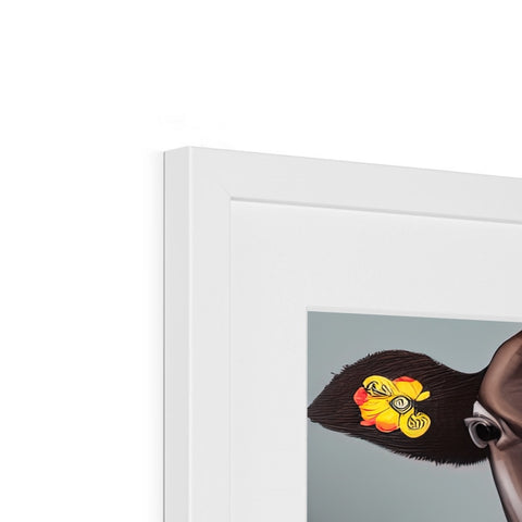 A monkey stuffed in a picture frame near some white photo of Golliwogs.