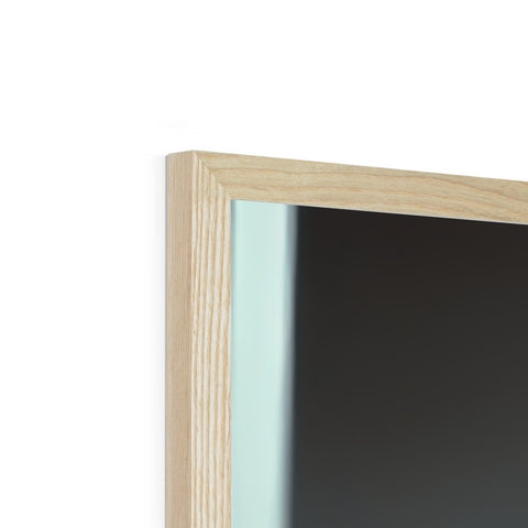 A picture frame holding a window and a piece of wooden wall in it.