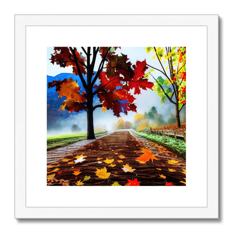 An art print with some fall foliage hanging on a wooden floor.