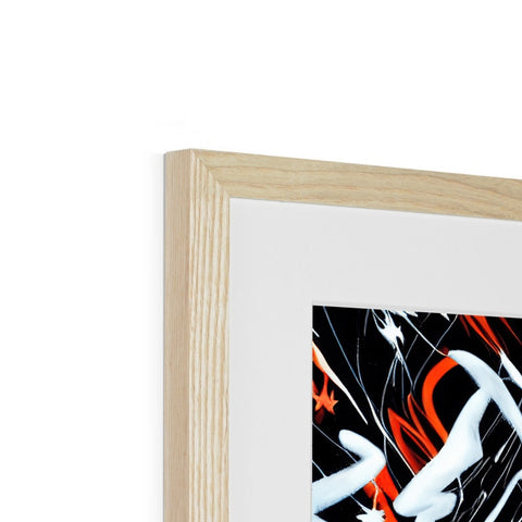 A black and white picture frame with a wooden background that has red paint on it.