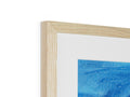 There are pictures of the ocean on a wooden frame.