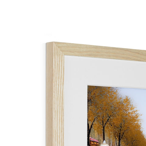 A picture frame in a small picture is displayed with a few different trees.