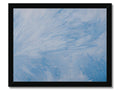 An abstract painting of a blue sky with snow floating down on all sides.