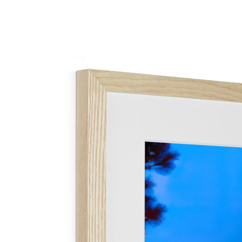 A picture with a picture frame in a blue frame of wood in a frame.