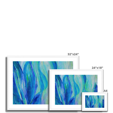 Three of the most beautiful frames on a blue couch filled with colorful photographs, a white