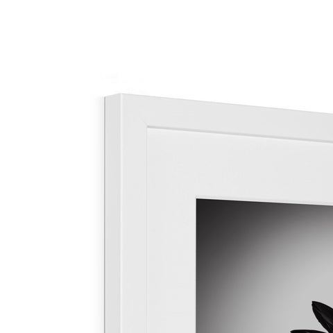 A white picture frame with an apple logo sticking out of it and a clock.