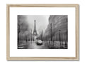 A colorful image of Paris on a black and white framed piece of metal.