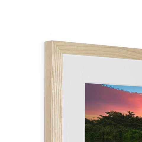A wooden art print frame with a picture on the top of it