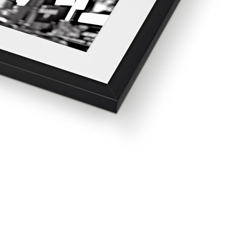 A photo of a black and white picture frame in a white frame.