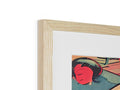 A view of a wooden frame with an art print on it next to two frames.