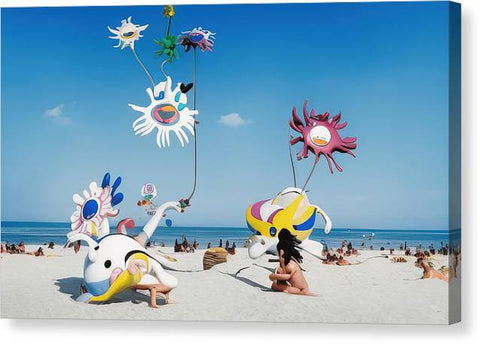 An octopus kite with people at the beach on the side