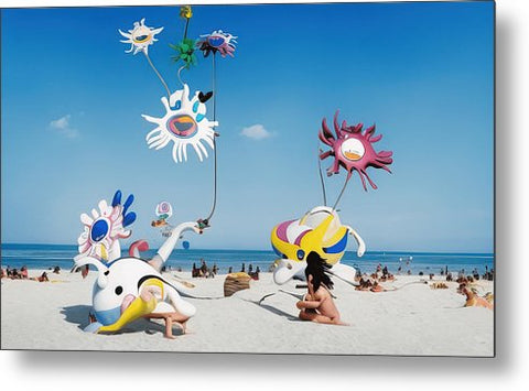 Sunbathers on a colorful beach in the sun with their kitesCopyright