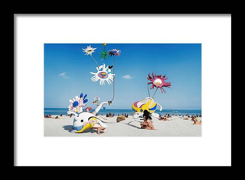 Art print depicting people standing on a beach with colorful flowers and palm trees