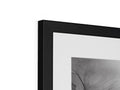 A picture of a white photo frame covered in a black frame