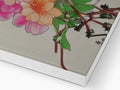 A white wooden box with flowers and paper printed cards inside it.