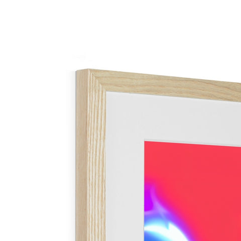 A picture of wood hanging in a picture frame in a frame with colorful artwork.