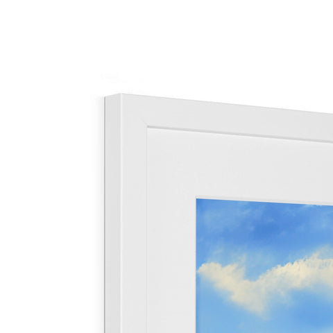 A white picture frame containing a colorful picture of a cloud.
