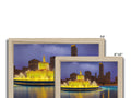 A photo printed picture frame with a city skyline next to a small fountain of gold.