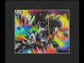 A painting in a frame of art print has many colors splattered on it.