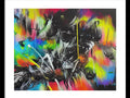 An art print that is spray painted in color by a graffiti artist.