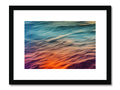 An art print of a piece of artwork facing a boat filled with water and waves.