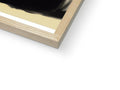 A picture of a black paperback book sitting on a piece of wood.