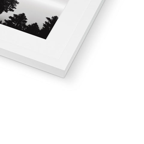 A white print of a picture frame sitting on top of a white plate.