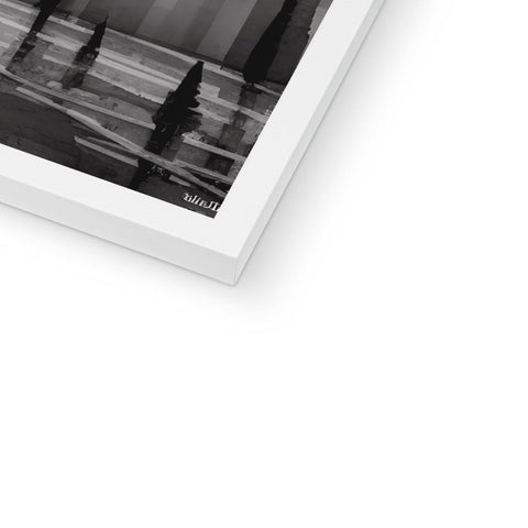 A white photo file on a black and white hardcover of an album.